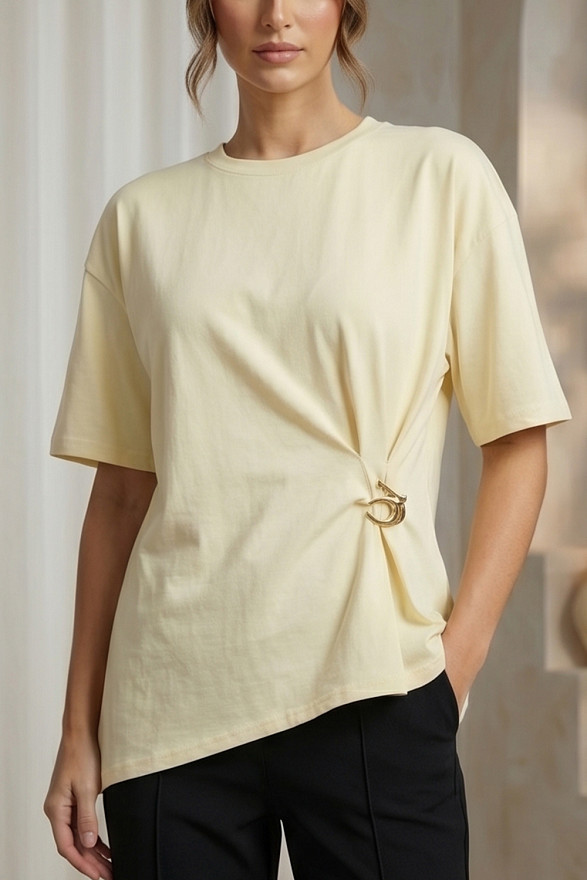 Yellow asymmetrical loose T-shirt with a slit and a brooch