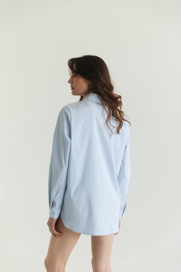 Blue cotton shirt with functional buttons on the sides