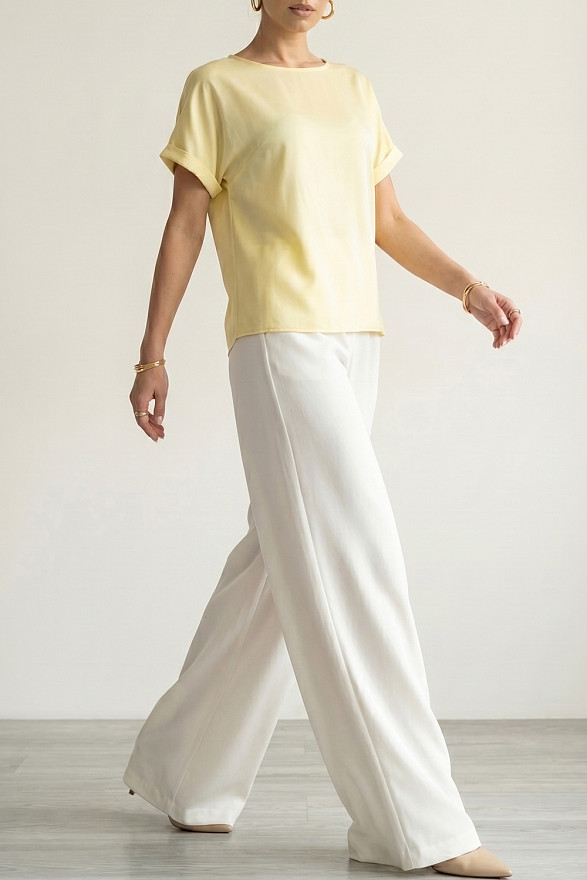 Білі вільні жіночі штани на гумці з кишенями