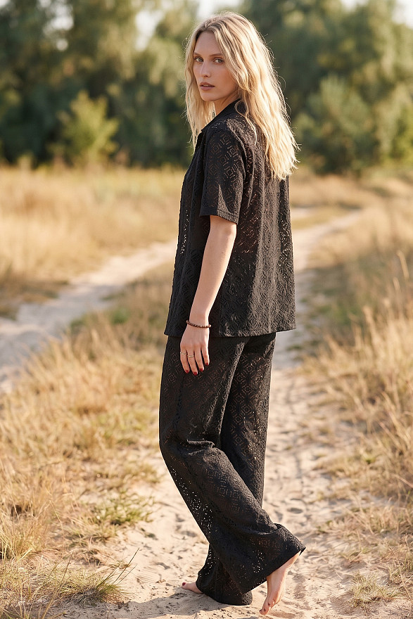 Black women's guipure suit