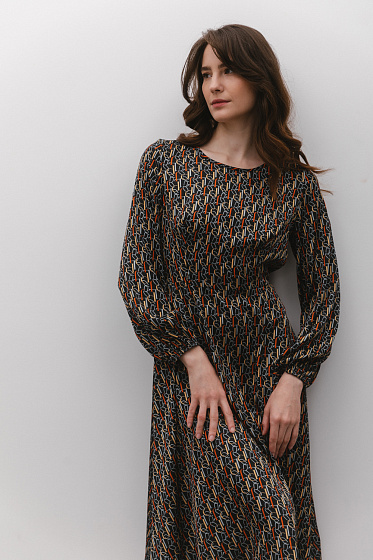 Refined and comfortable semi-fitted midi dress with a magical loose skirt. The back is ribbed at the waist for a sleek silhouette. The long sleeves are gathered with an elastic band, adding charm. This dress will highlight your femininity and style, perfect for special moments and casual outings.