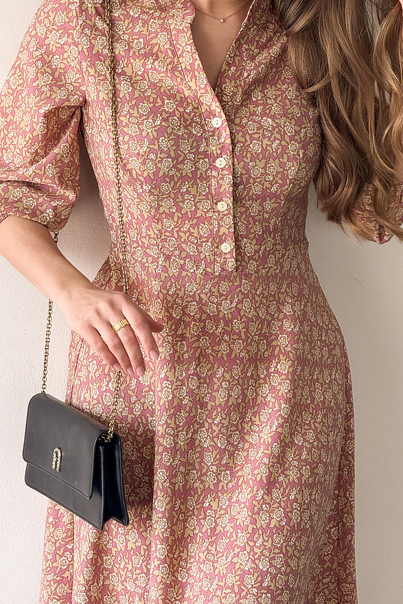 Pink fitted dress with flared skirt