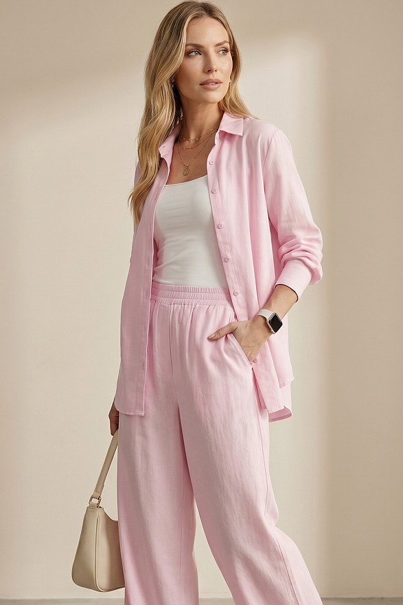 Loose-fitting pink blouse with a belt