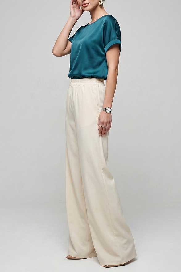 Кремові вільні жіночі штани на гумці з кишенями