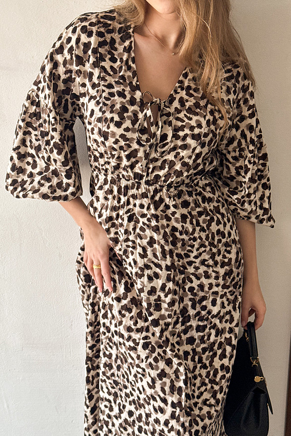 Loose midi dress with elastic band, V-neck and puff sleeves