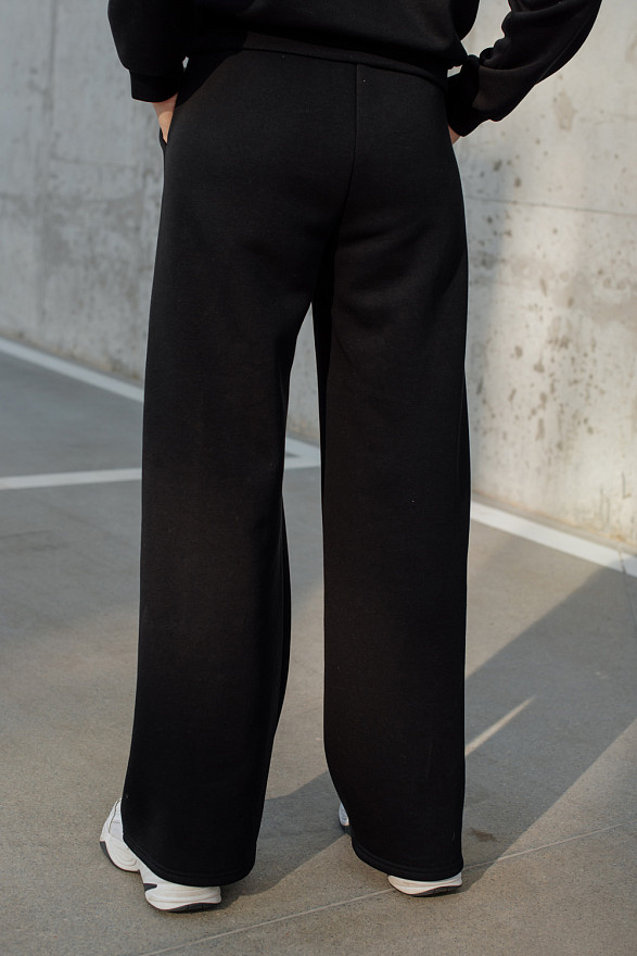 Warm black flared trousers with arrows