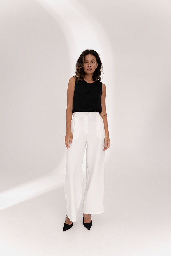 Молочні широкі штани на поясі з боковими кишенями