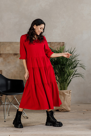 Loose-fit midi dress with ruffles and gathering. Loose ¾ sleeve with elastic band, round neckline, pleasant to the body cotton fabric.