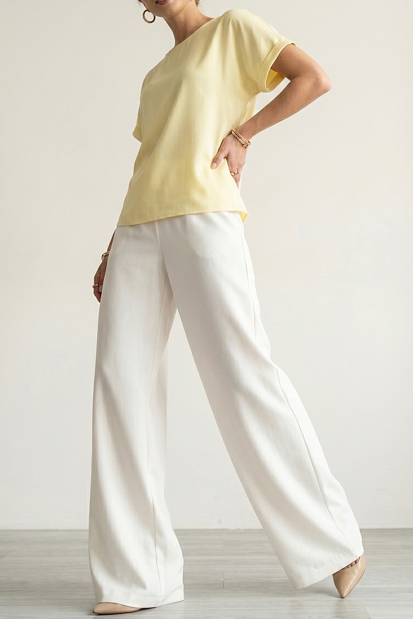 Білі вільні жіночі штани на гумці з кишенями