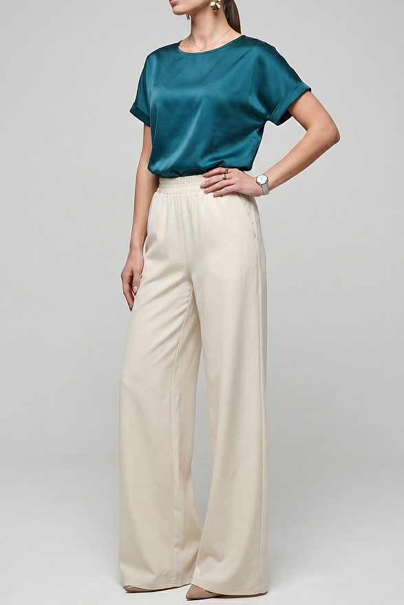 Кремові вільні жіночі штани на гумці з кишенями