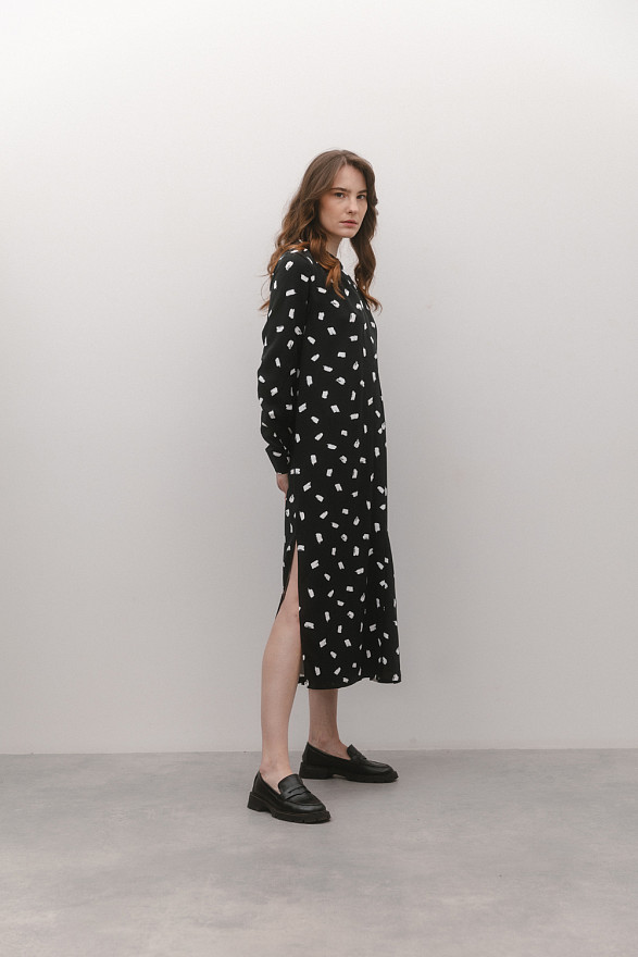 Black slip dress with slits at the side seams