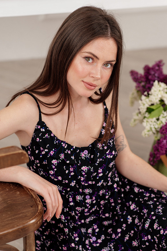 Black mini dress with buttons and straps