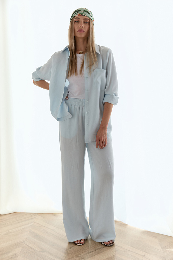 Блакитні широкі штани з поясом на резинці