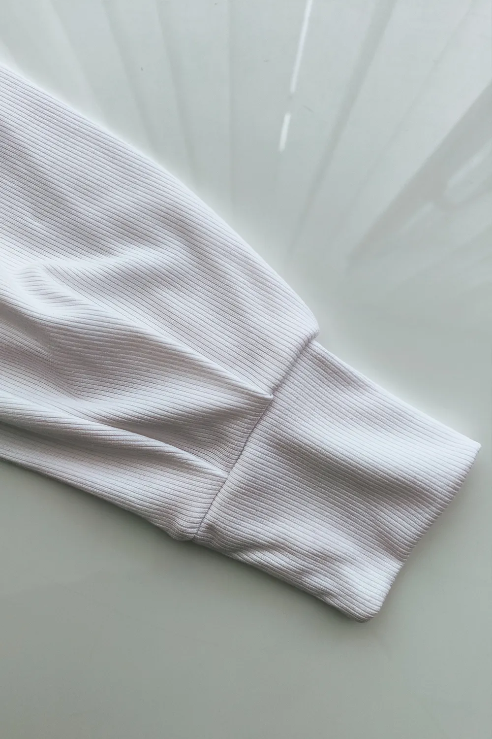 White turtleneck with puffy sleeves