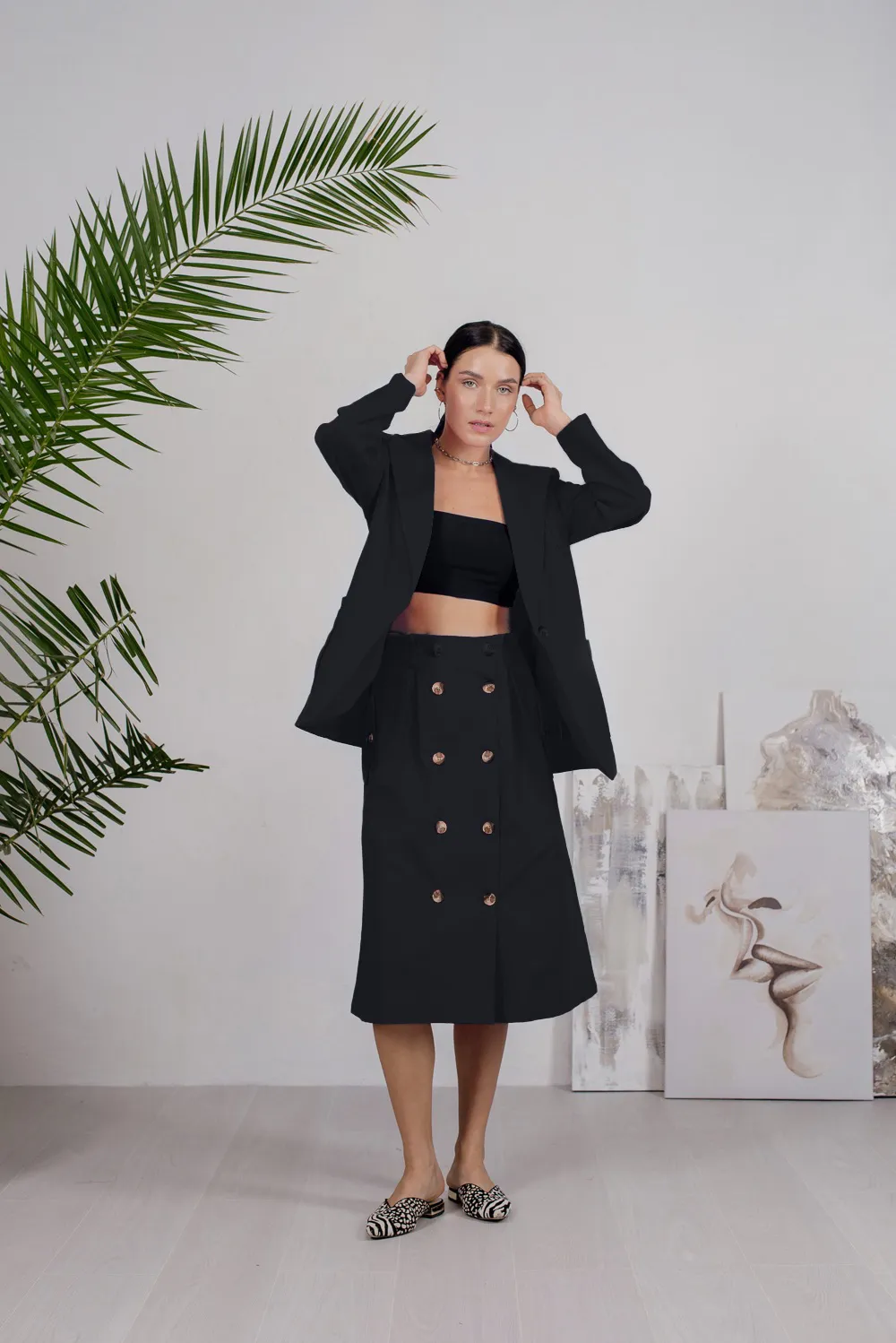 Black denim skirt with buttons and side pockets