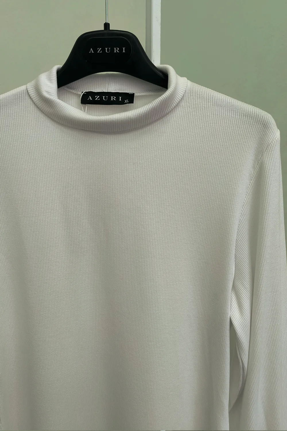 White turtleneck with puffy sleeves