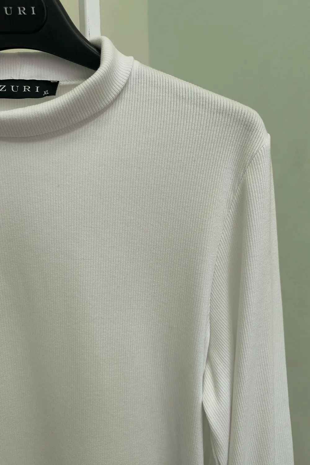 White turtleneck with puffy sleeves