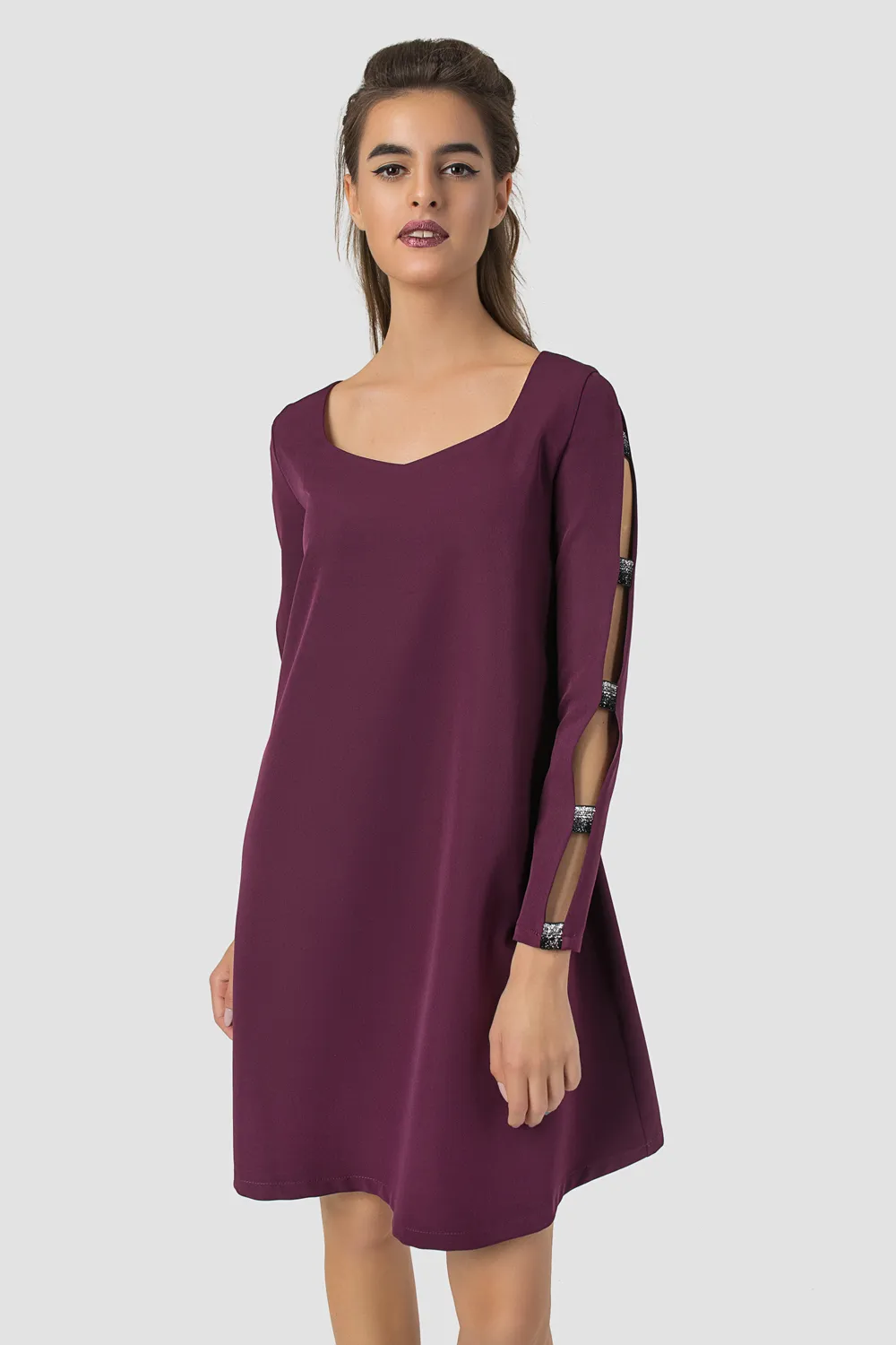 Dress with decorative inserts