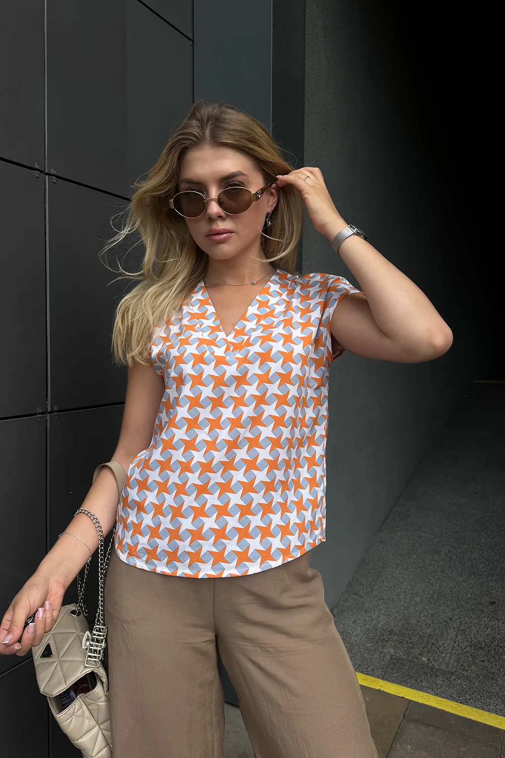 Lightweight orange staple blouse