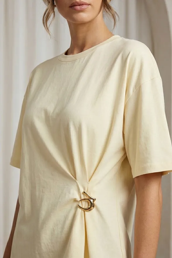 Yellow asymmetrical loose T-shirt with a slit and a brooch — buy