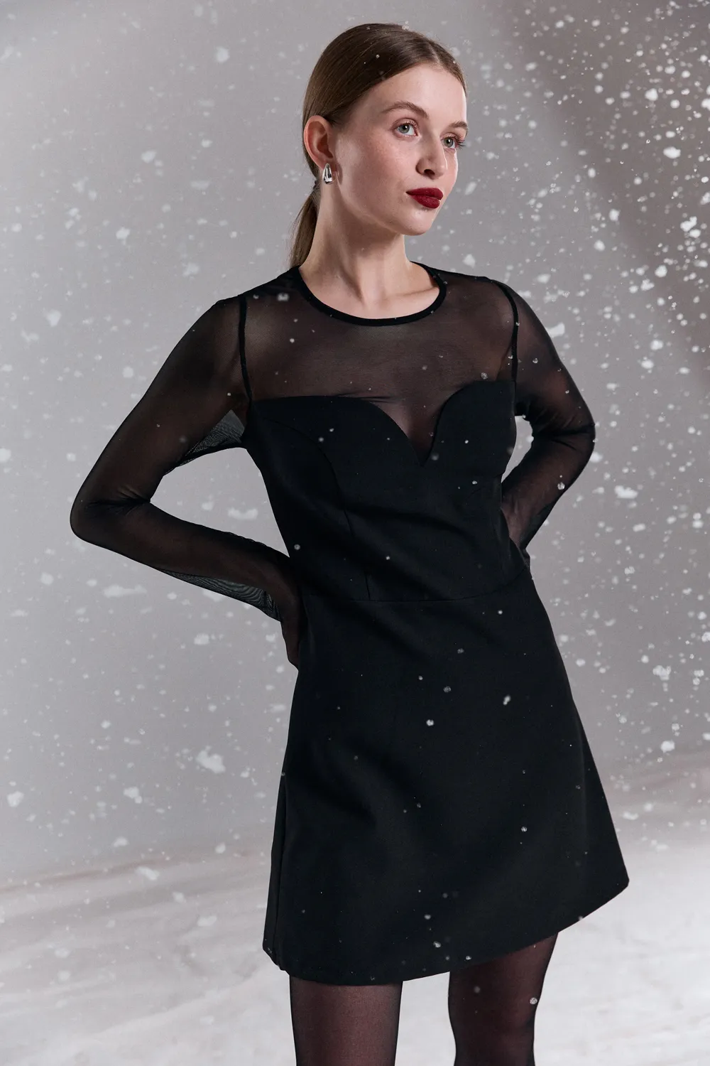 Black elegant mini dress with a shaped neckline