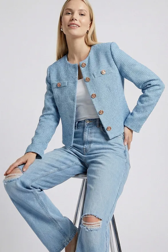 Light blue cropped jacket with gold buttons and pleats on the back